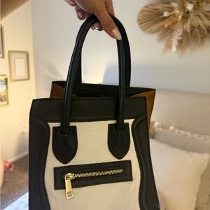 Elegant Black and White Crossbody Bag with Gold Accents